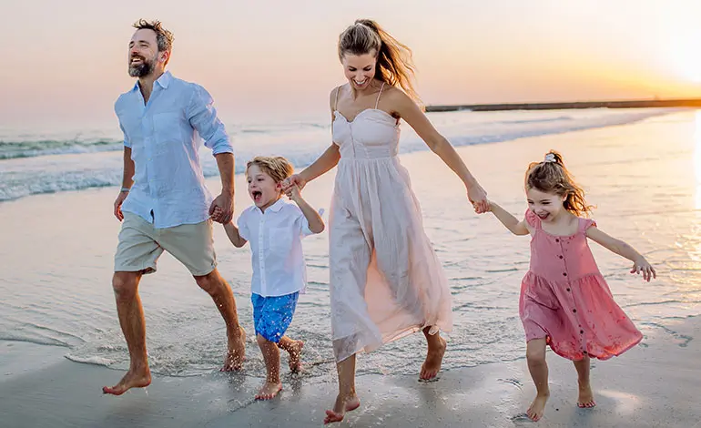 family having fun at the seaside