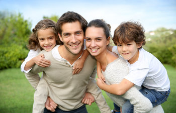 happy family smiling in the garden